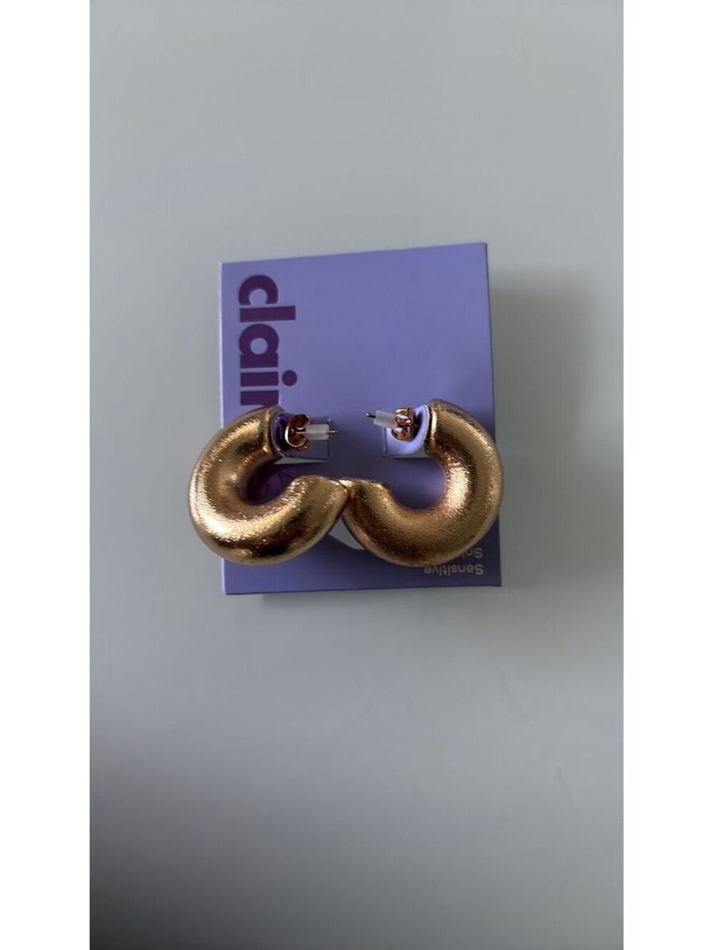 chunky, metallic gold-toned domed hoop earrings
